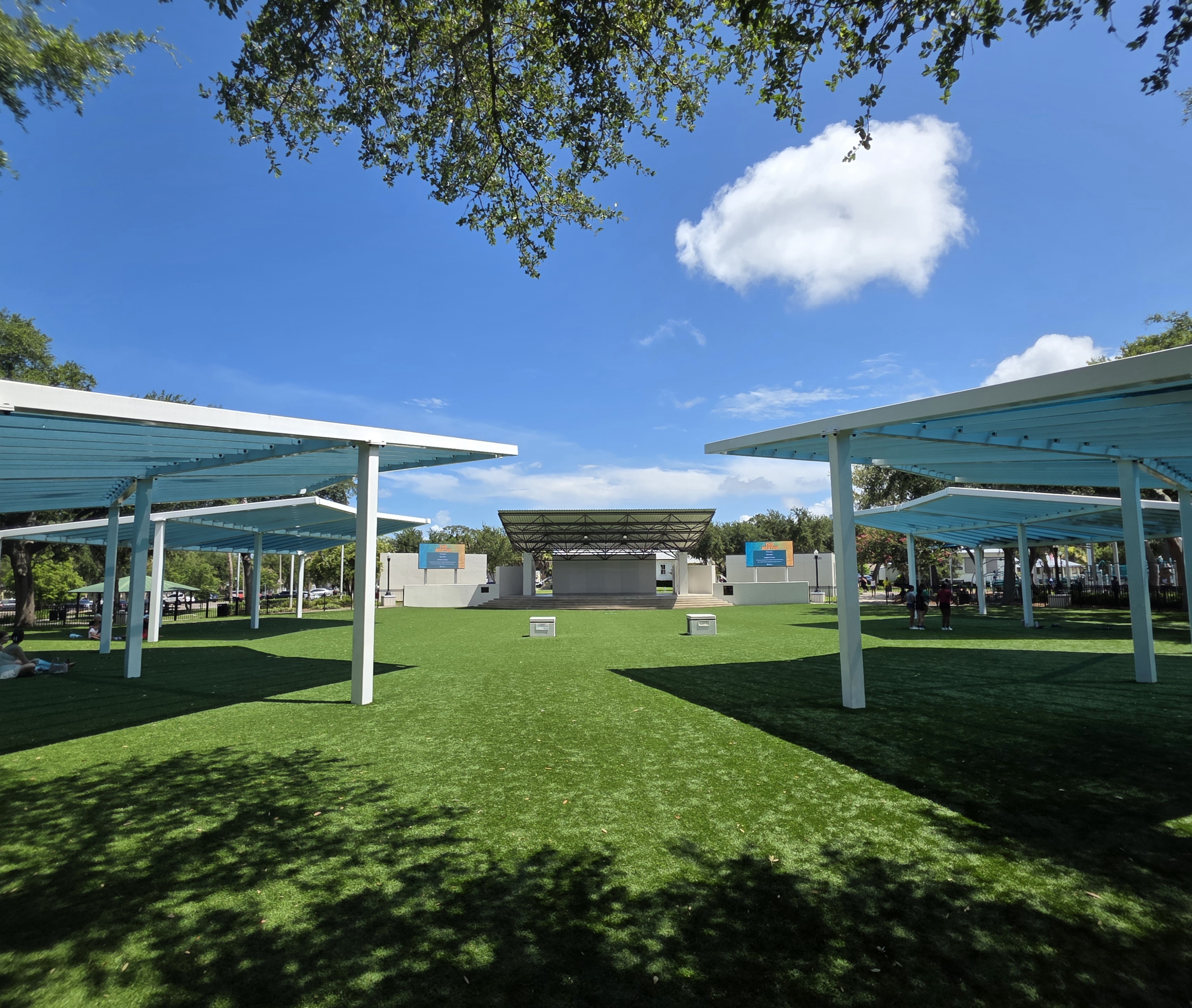Original photo of Sims Park lawn and stage.